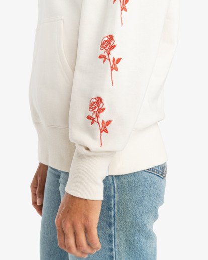 White sweatshirt with store roses